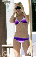 Ashley Tisdale in purple bikini