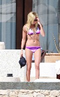 Ashley Tisdale in purple bikini