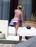 Ashley Tisdale in purple bikini