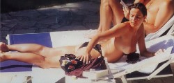 Cristina Parodi nude in Topless sunbathing