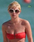 Elisha Cuthbert in bikini at the beach