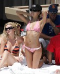 Eva Longoria in Sunbathing by the pool
