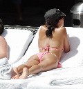 Eva Longoria in Sunbathing by the pool