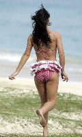 Evangeline Lilly in pink bikini