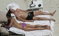 Helena Christensen nude in Topless sunbathing