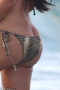 Kim Kardashian in gold bikini