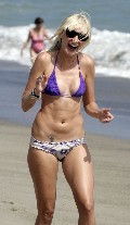 Kimberly Stewart in bikini at the beach