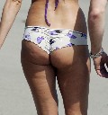 Kimberly Stewart in bikini at the beach