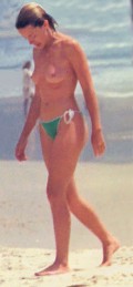 Kylie Minogue nude in topless at the beach