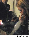 Miley Cyrus in Miley tokin' on a bong
