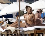 Oksana Andersson nude in Topless sunbathing
