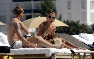 Oksana Andersson nude in Topless sunbathing