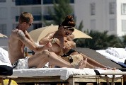 Oksana Andersson nude in Topless sunbathing
