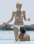 Sharon Stone nude in topless at the beach