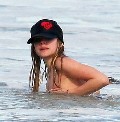 Avril Lavigne nude in Nipple slip at the beach