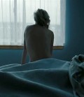 Charlize Theron nude in The Burning Plain