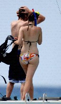 Delta Goodrem in bikini on a yacht