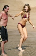 Denise Richards in purple bikini