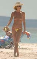 Elle Macpherson nude in topless at the beach