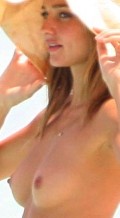 Miranda Kerr nude in topless at the beach