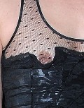 Milla Jovovich nude in Nipple Slip