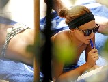 Miranda Kerr nude in topless on  a balcony
