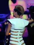 Rihanna in Stripes suit in Concert