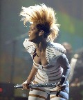 Rihanna in Stripes suit in Concert