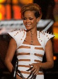 Rihanna in Stripes suit in Concert