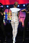 Rihanna in Stripes suit in Concert