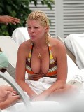 Tara Reid in orange bikini