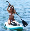 1024x768, 138 KB, Cindy_Prado_wearing_a_white_bikini_while_paddblboarding_in_Miami.jpg