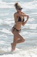778x768, 104 KB, Charlotte_McKinney_in_a_bikini_at_a_beach_in_Santa_Monica_-01.jpg