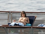 Elizabeth Hurley nude in Topless sunbathing