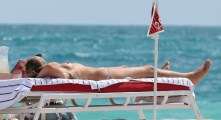 Alina Baikova nude in topless at the beach