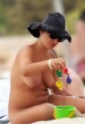 Camila Raznovich nude in topless at the beach