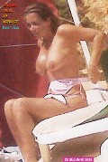 Elsa Raposo nude in Topless sunbathing