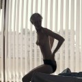 Elizabeth Debicki nude in The Burnt Orange Heresy