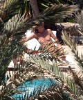 Heidi Klum nude in Topless sunbathing