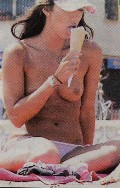 Leilani Dowding nude in Topless sunbathing