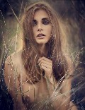 Malgosia Bela nude in topless photoshoot