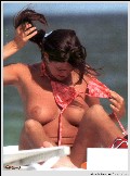 Manuela Arcuri nude in Topless sunbathing