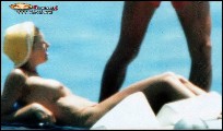 Martina Colombari nude in Topless sunbathing
