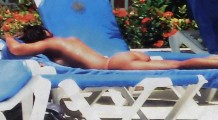 Nuria Madruga nude in Topless sunbathing