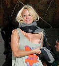 Pamela Anderson nude in Vivienne Westwood Fashion Show