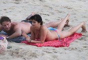 Shermine Sharivar nude in topless at the beach