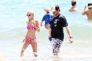 Tori Spelling in pink bikini