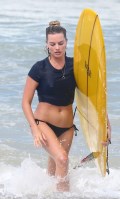 647x768, 67 KB, Margot_Robbie_in_a_black_bikini_on_a_beach_in_Costa_Rica.jpg